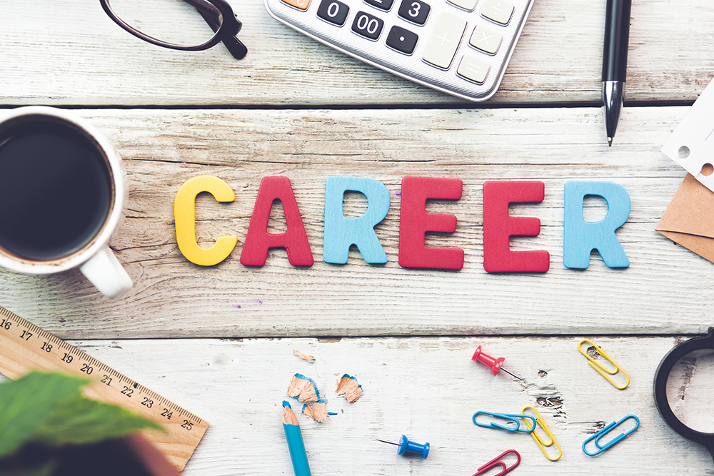 <p>Career sign on a wooden desk in an office</p>
