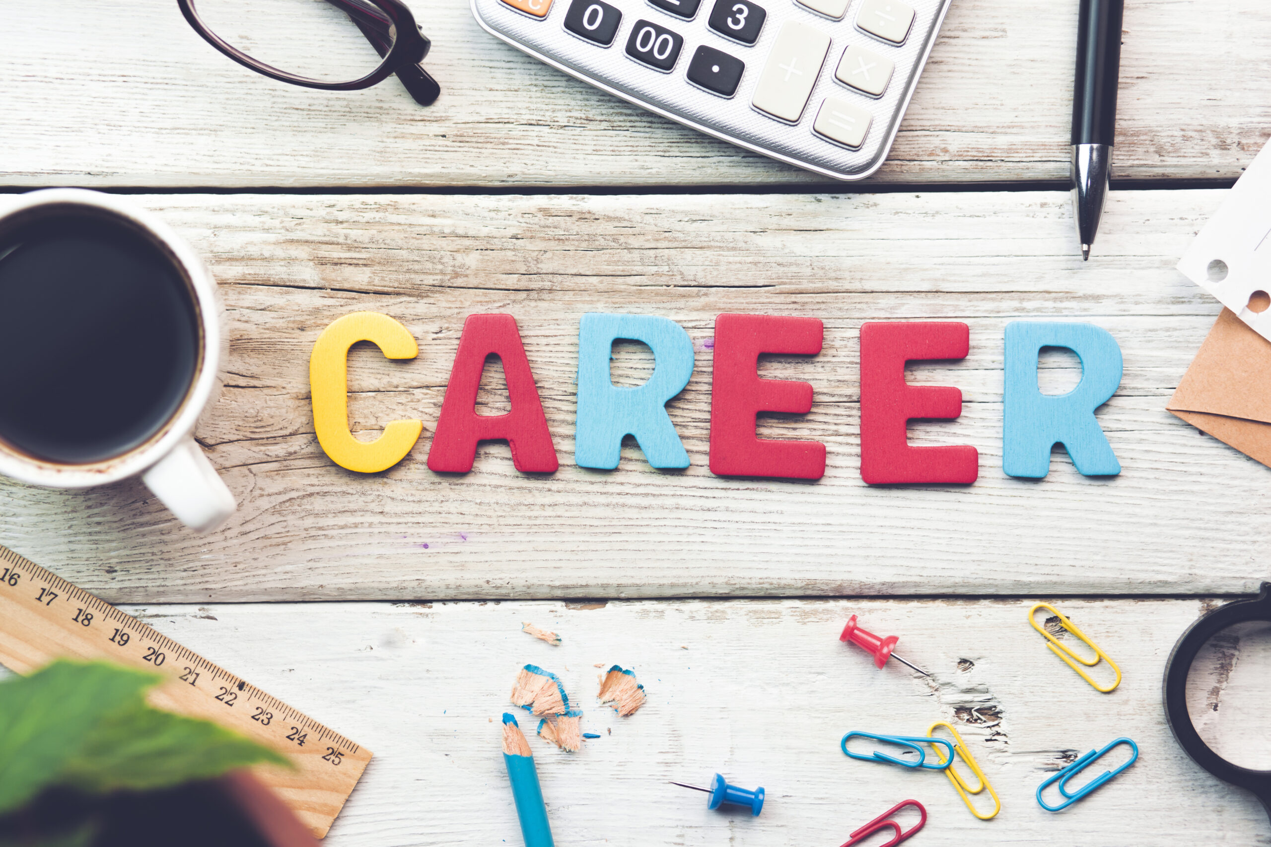 <p>Career sign on a wooden desk in an office</p>
