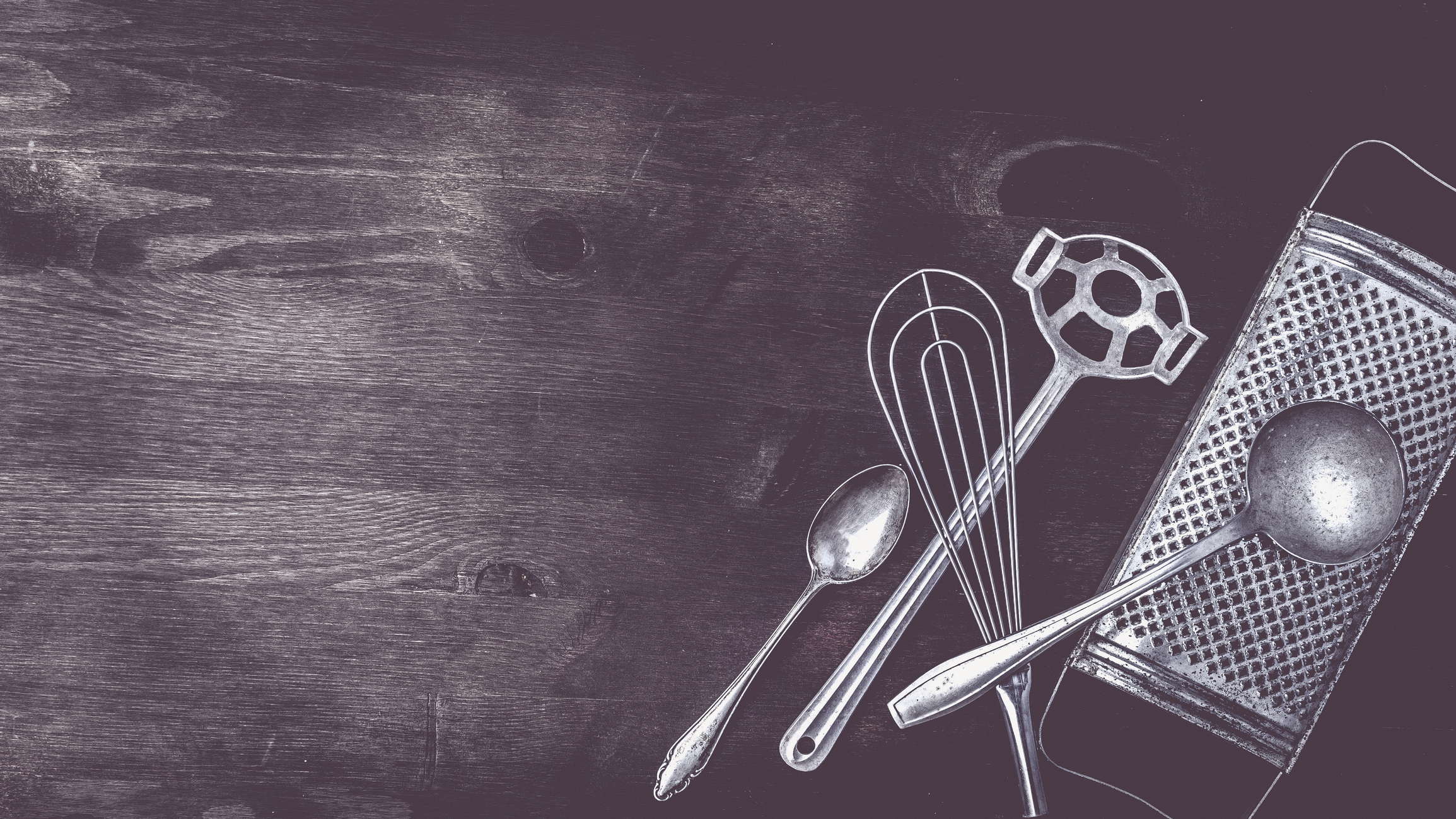 <p>Kitchen utensils on a dark wooden background</p>
