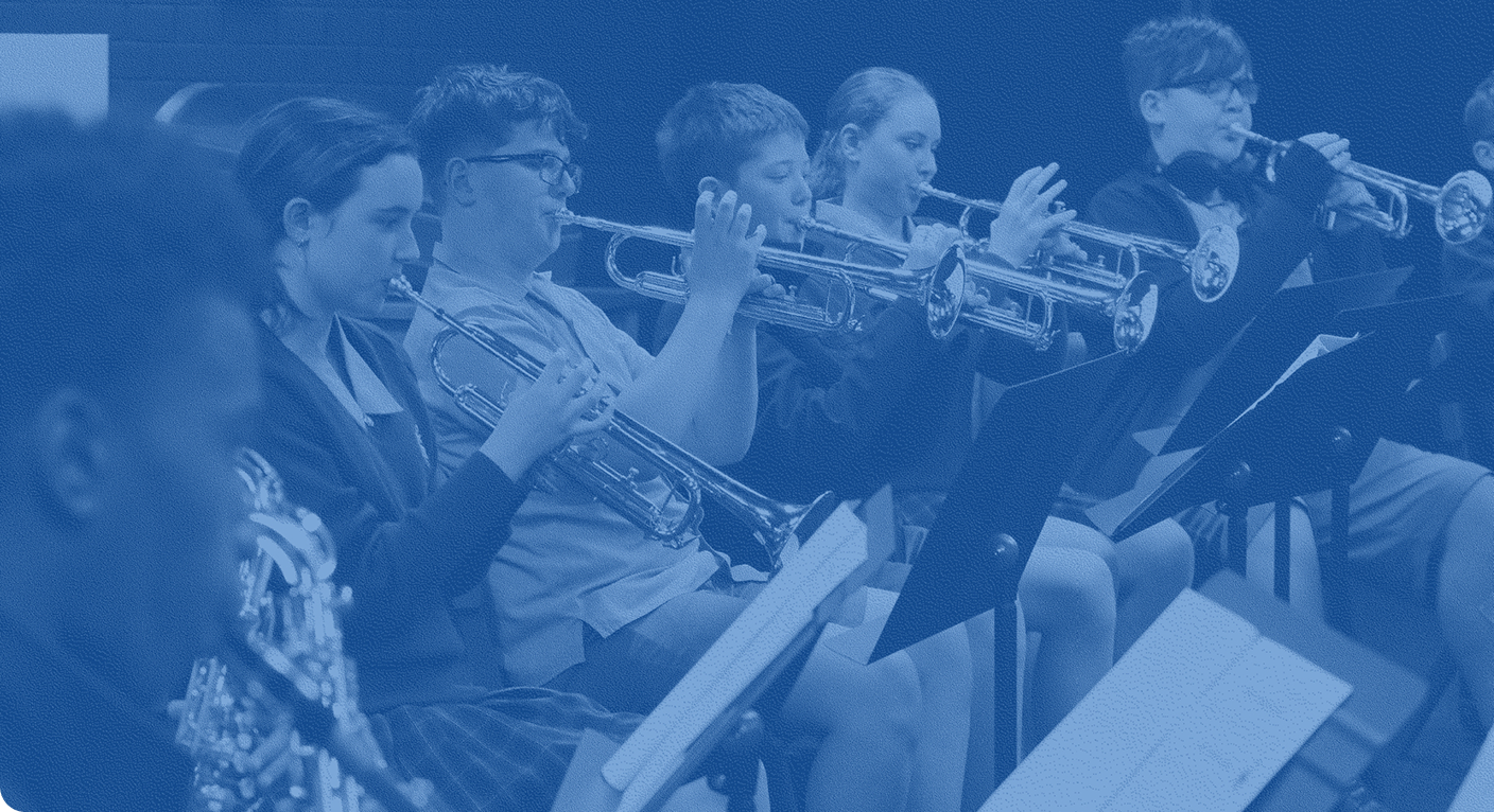A group a students playing in a school band