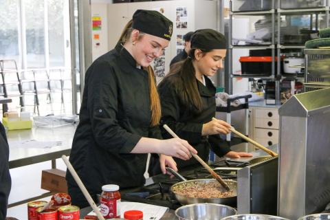 Two students in a cooking class