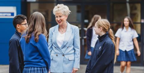 The SFX principal talking to some students