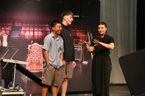 2 students doing a performance for English