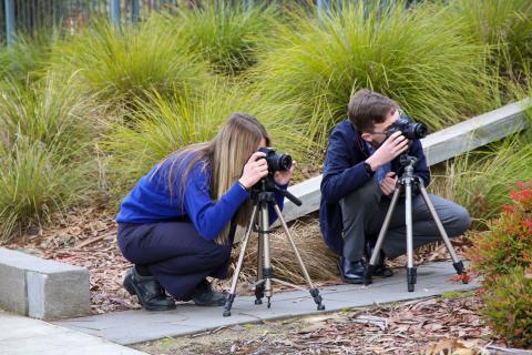 Two students doing photography